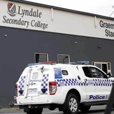 Death 'not suspicious' after body found at school