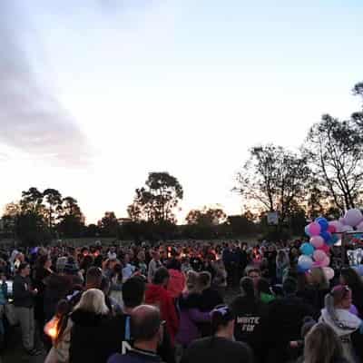 Community vigil for siblings who died in shed fire