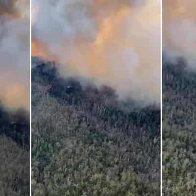 Explosives, homes under threat as fire rages in NSW