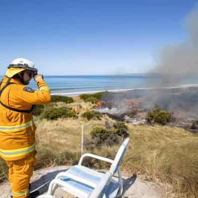 Weather helps firefighters tame destructive blaze