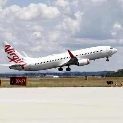 Virgin signs deal with ground staff, cabin threat looms